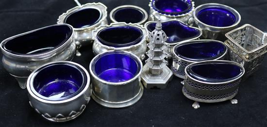 Pair of Chinese pierced silver salts and a pagoda pepper, nine silver salts with blue glass liners and two plated examples